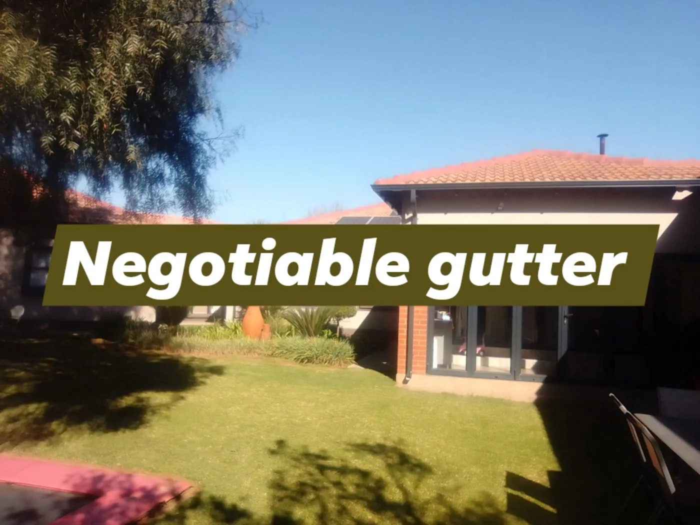 Gutter line finished across the rear elevation of a suburban home